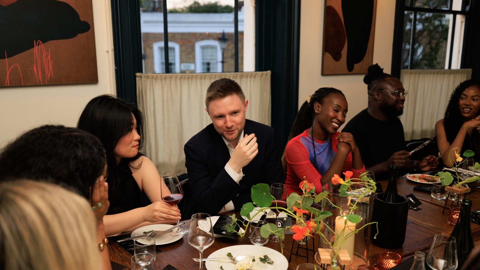 Nathan Spence speaking on stage with a microphone